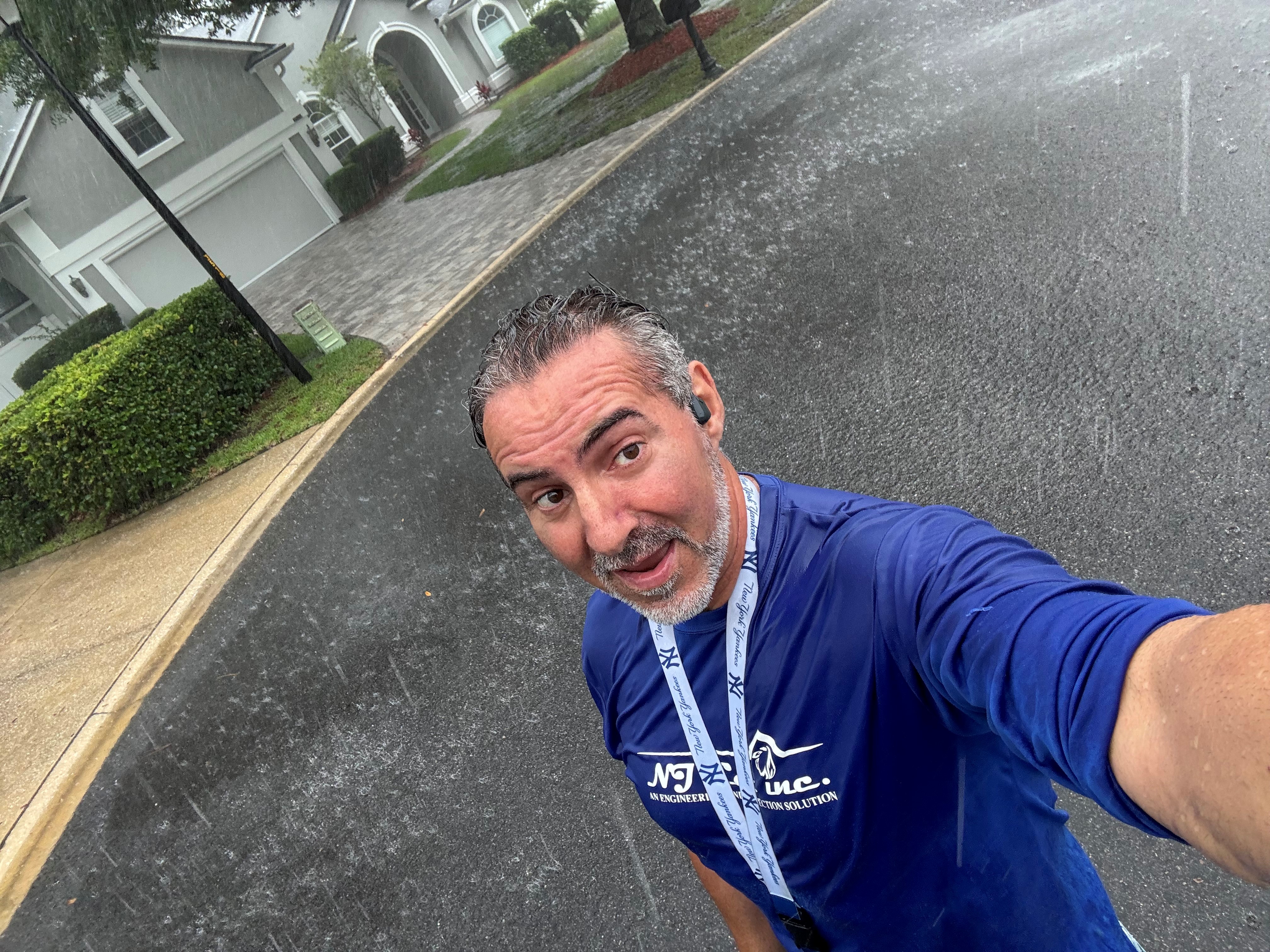 Nicholas J. Catalano working in South Florida rain